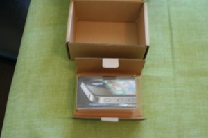Removing the iPhone4 box from the FedEx box